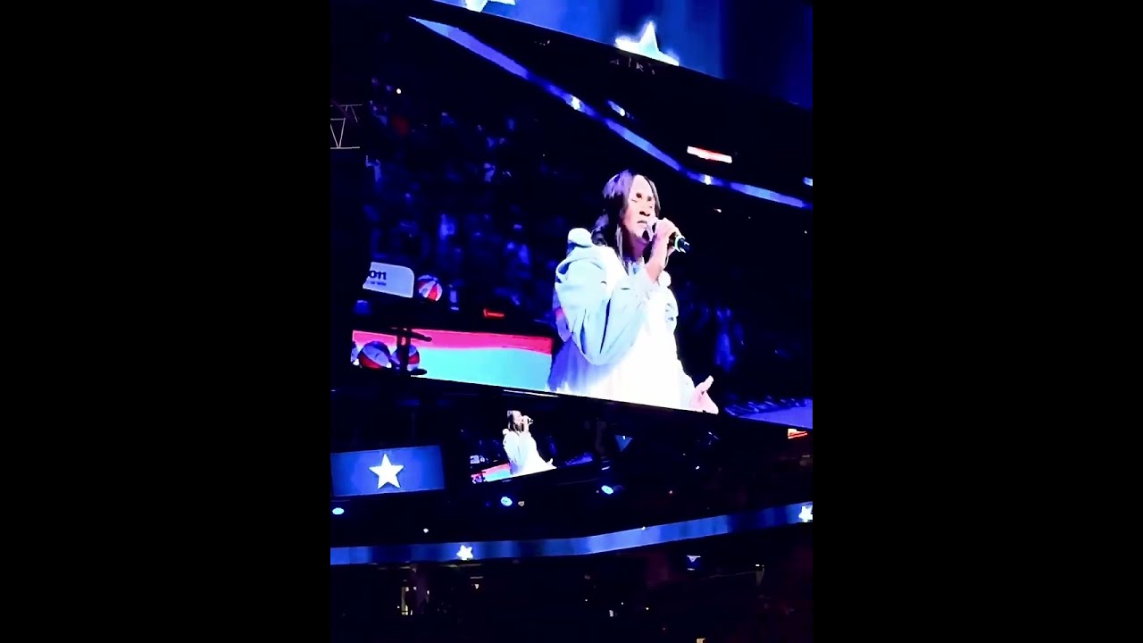 Anointed lady sings The National Anthem.