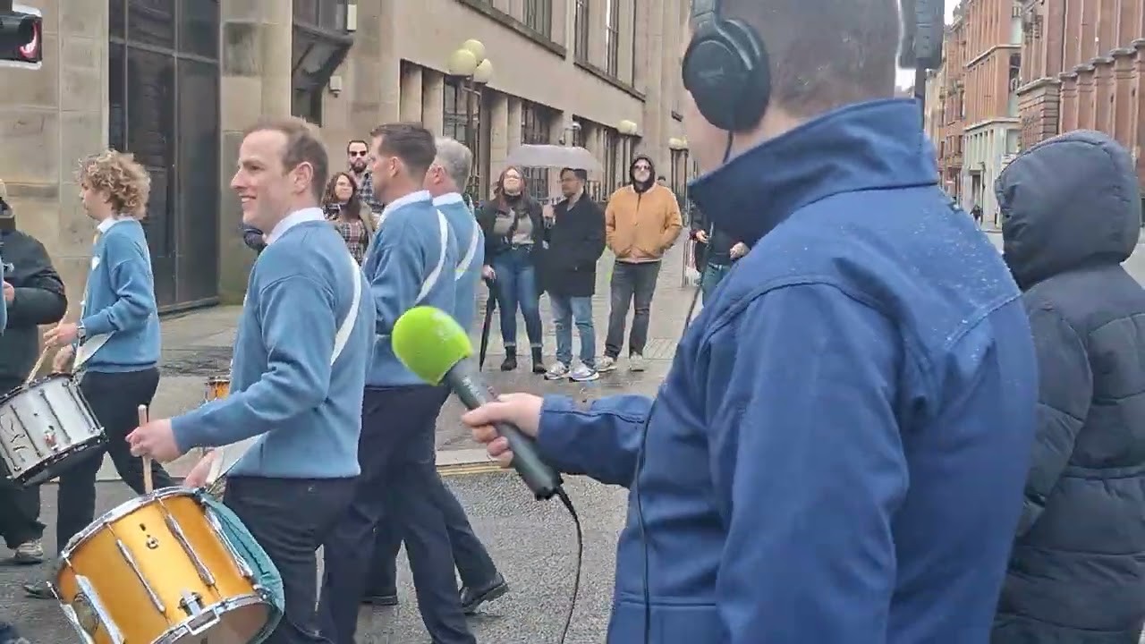 Glasgow 2026 Saint Patrick's Day parade with band playing Henry Joy and the Irish Rover.