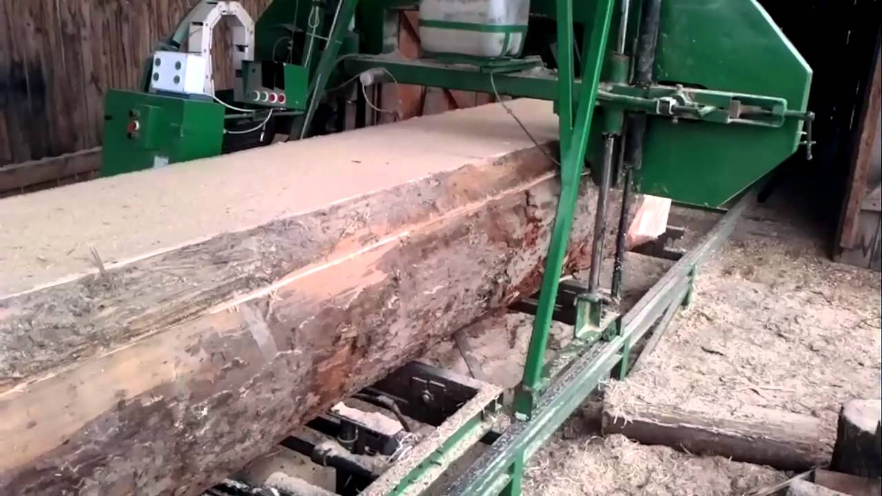 Cutting big logs with the homemade sawmill.