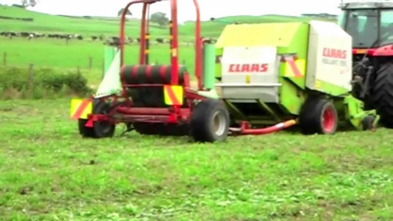 Massey Ferguson 6480 with Claas Rollant 255 and Taarup 7460 baling sorghum