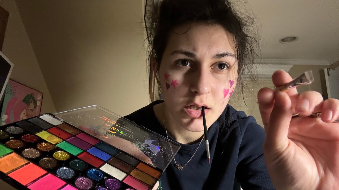 Tired college kid does your face paint 