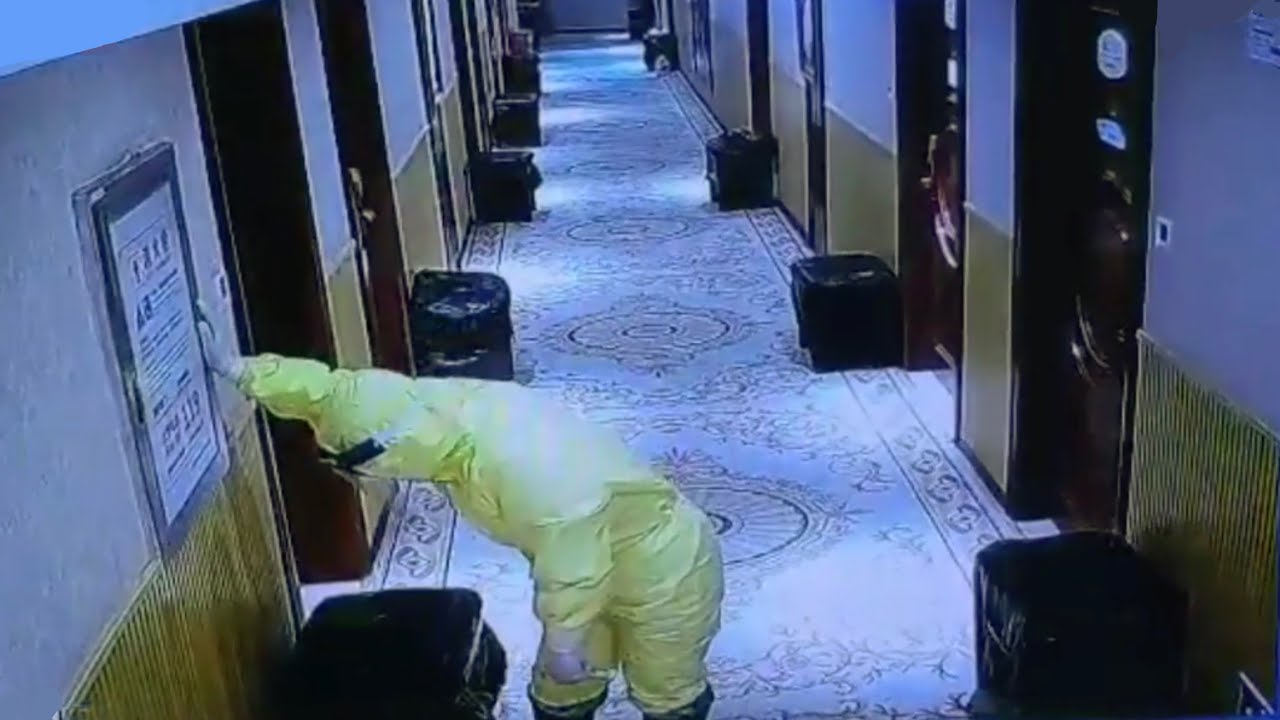 Video clip shows medical staff waddling down Hubei hospital corridor after long work shift