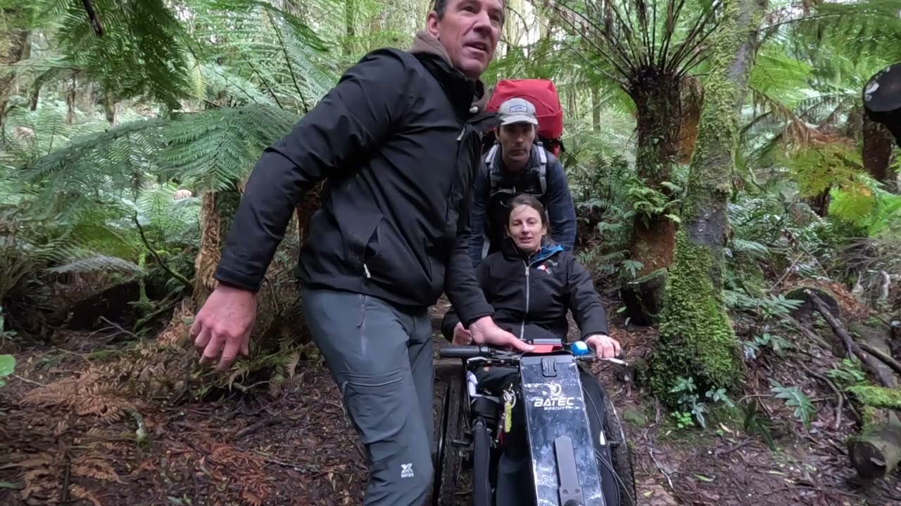 Disabled woman Investigates the top of Beauchamp Falls