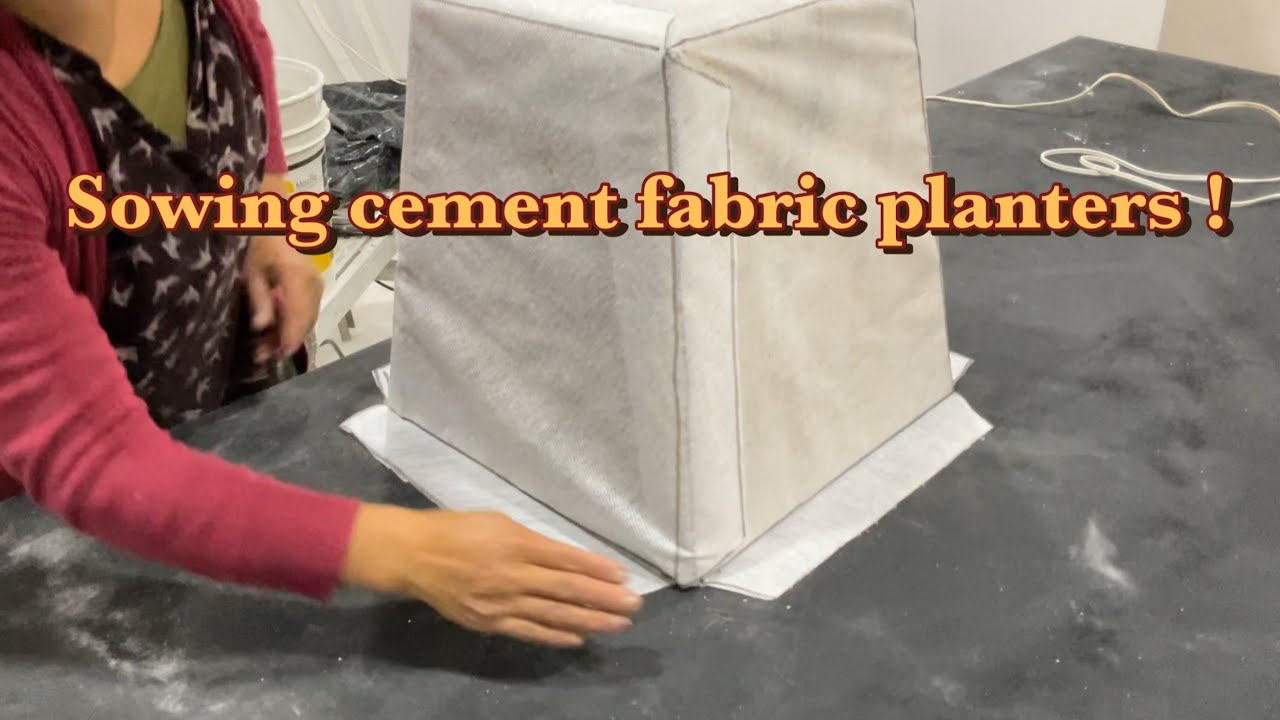 Sowing a cement planter using cement fabric into a pyramid shaped concrete planter. #fabricplanters