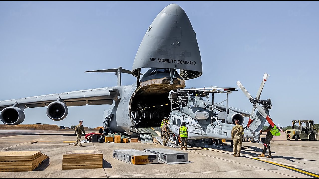 Massive C-5M Super Galaxy Loads UH-1Y and AH-1Z Viper Helicopters