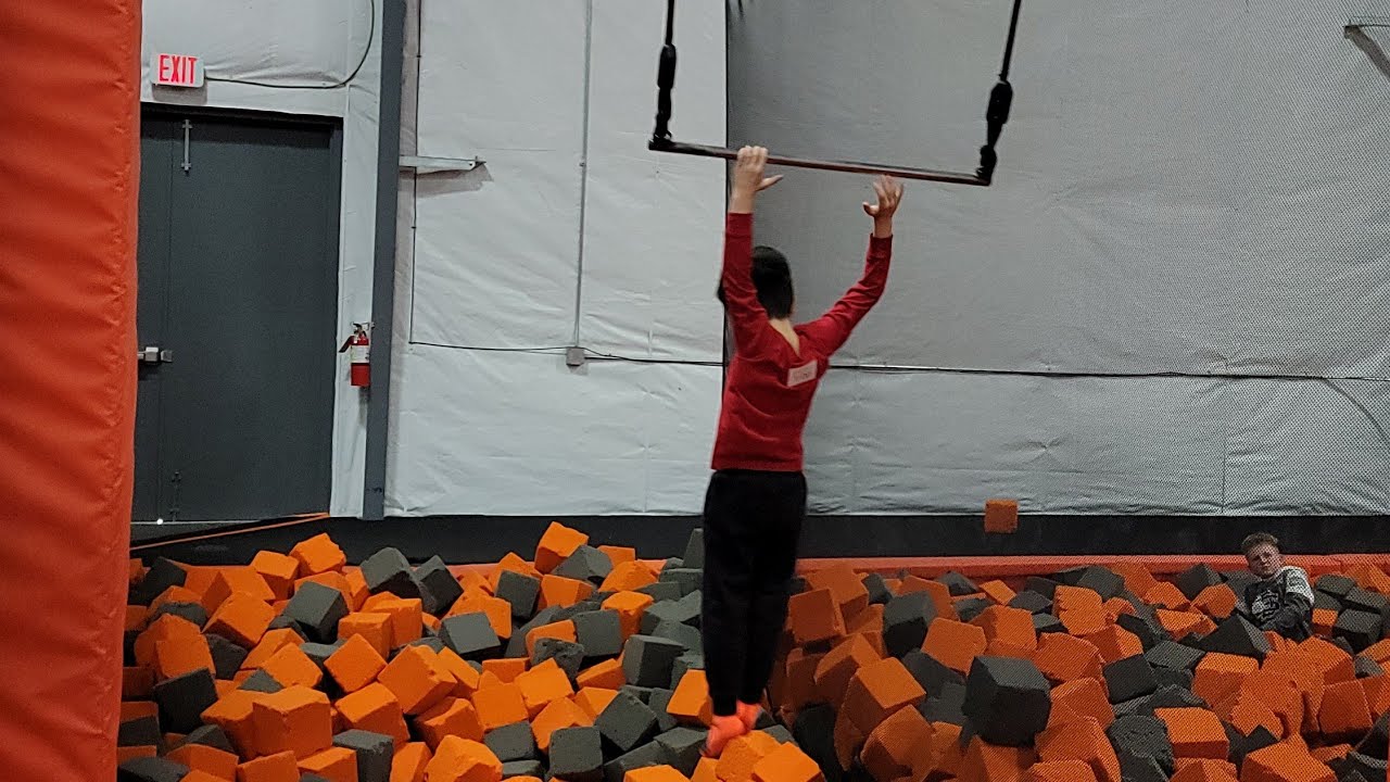 Swinging and Jumping into a Foam Pit | Air Madness Trampoline Park #shorts #foampit #swing #jump