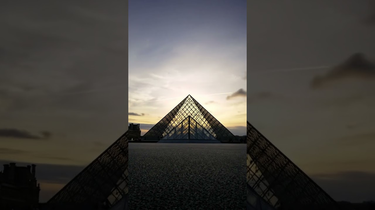 Under the night sky,the Louvre Glass Pyramid glows like a precious gem 