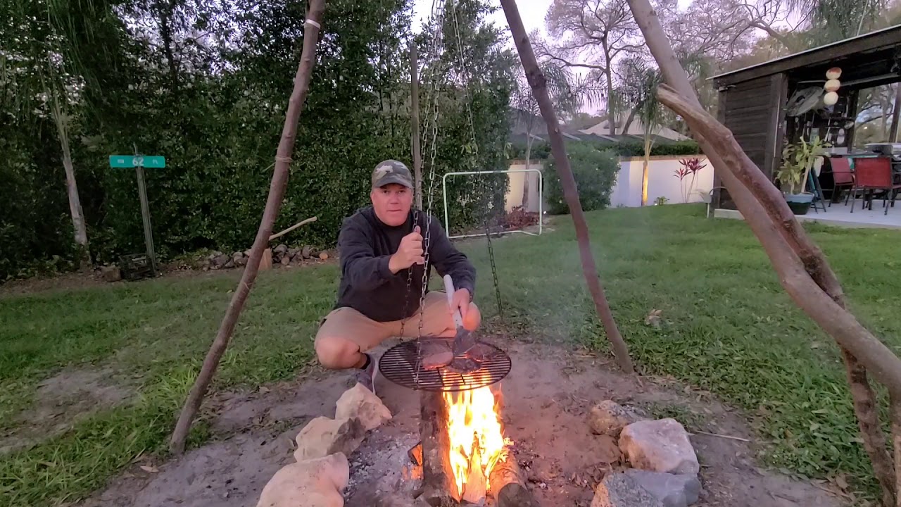 Cheeseburgers Over an Open Tripod Fire