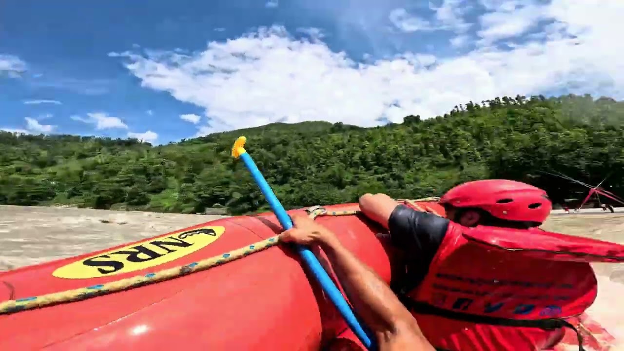 Raft Capsizes Surfing Nepal's High-Water Rapids