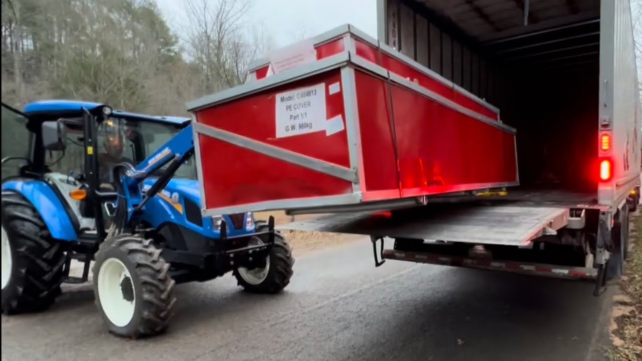 Container shelter site prep.  New Holland Work Master 75 Tractor working hard removing trees.