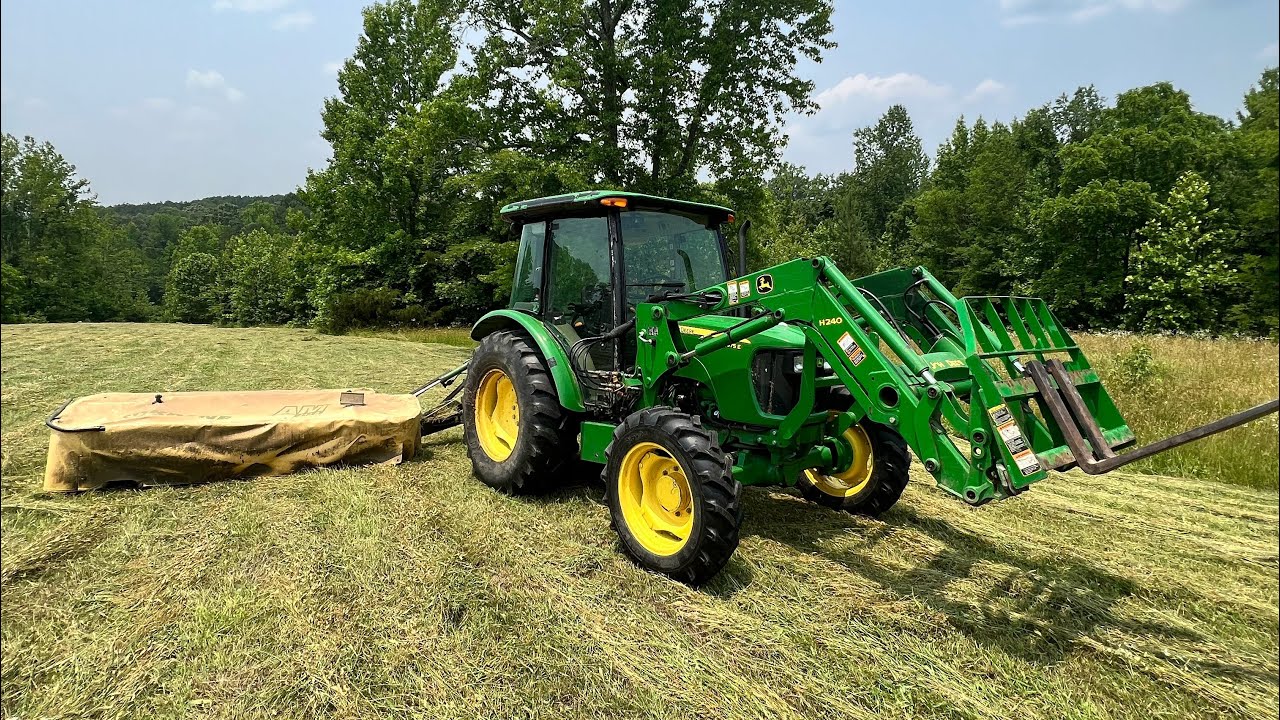 John Deere 5075E & Krone Disc Mower Cutting 1st Cut Hay.