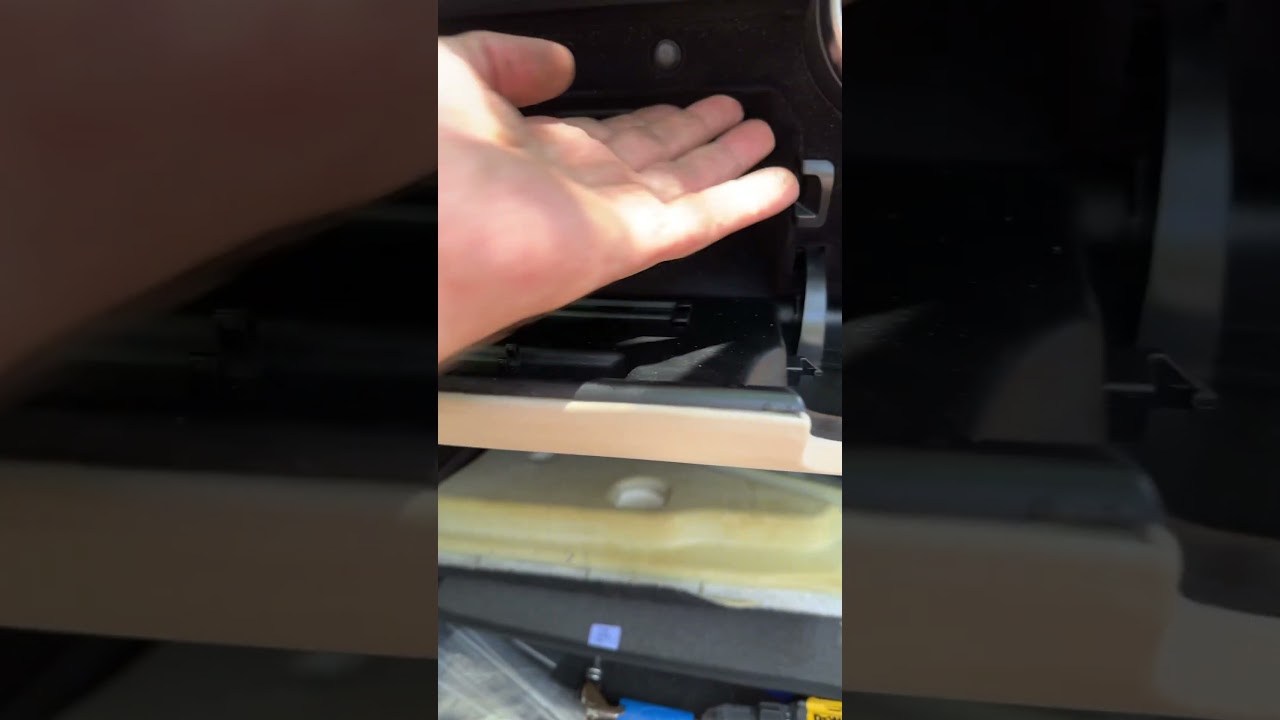 Removing two from inside glove compartment