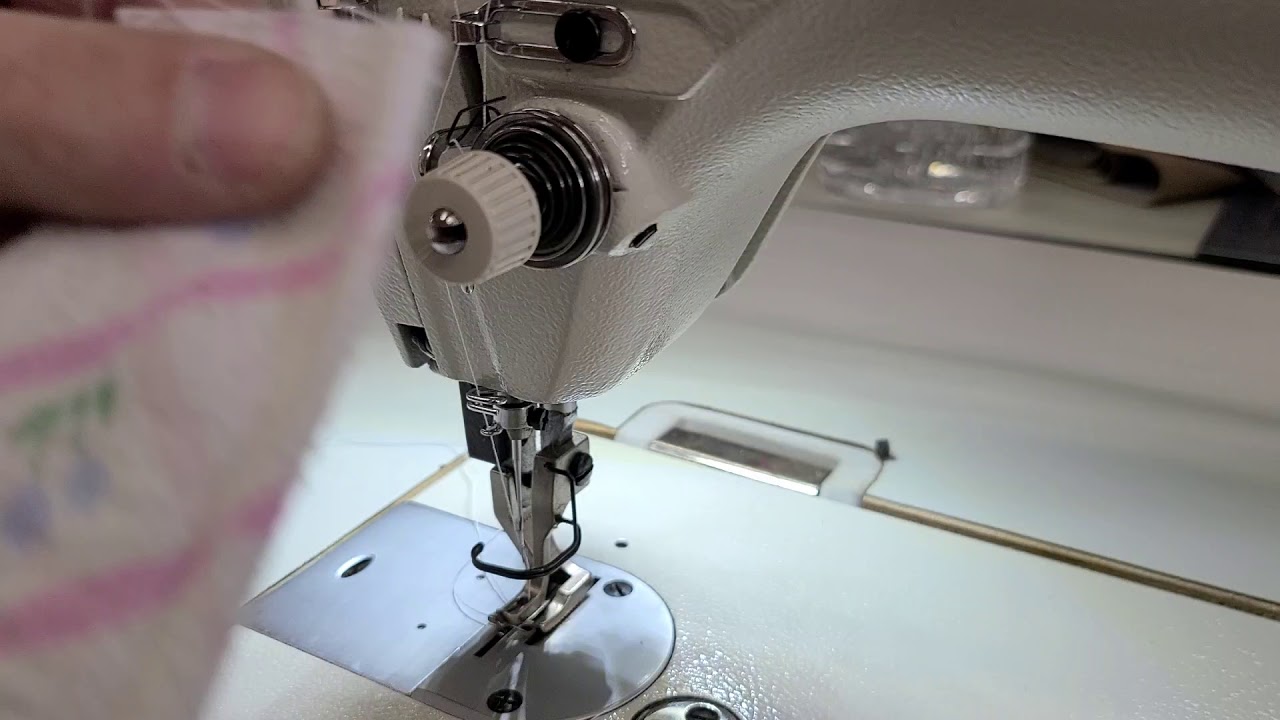 Adjusting the Juki DU-1181N to sew on lighter material with T40 thread.