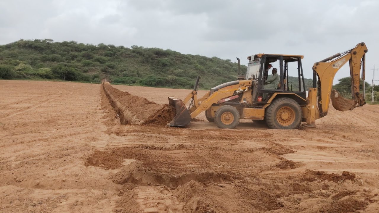 Cat 424 B backhoes pipeline digging work at farm #youtube #jcb #exavator #subcribe 