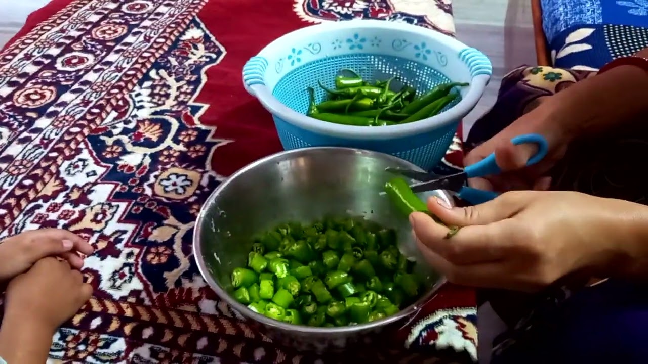 Cutting Green Chilly using scissor