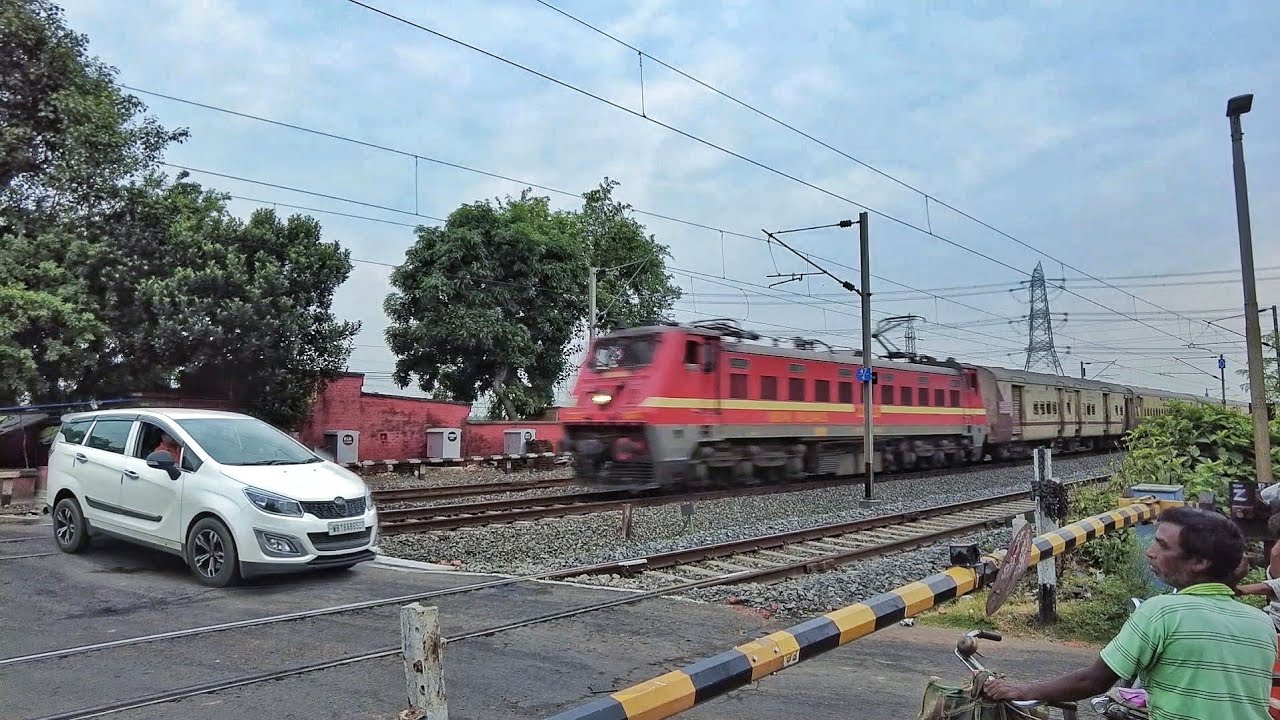 Dangerous situation Modern CAR passing on railgate : Furious speed  express train skipout at gate