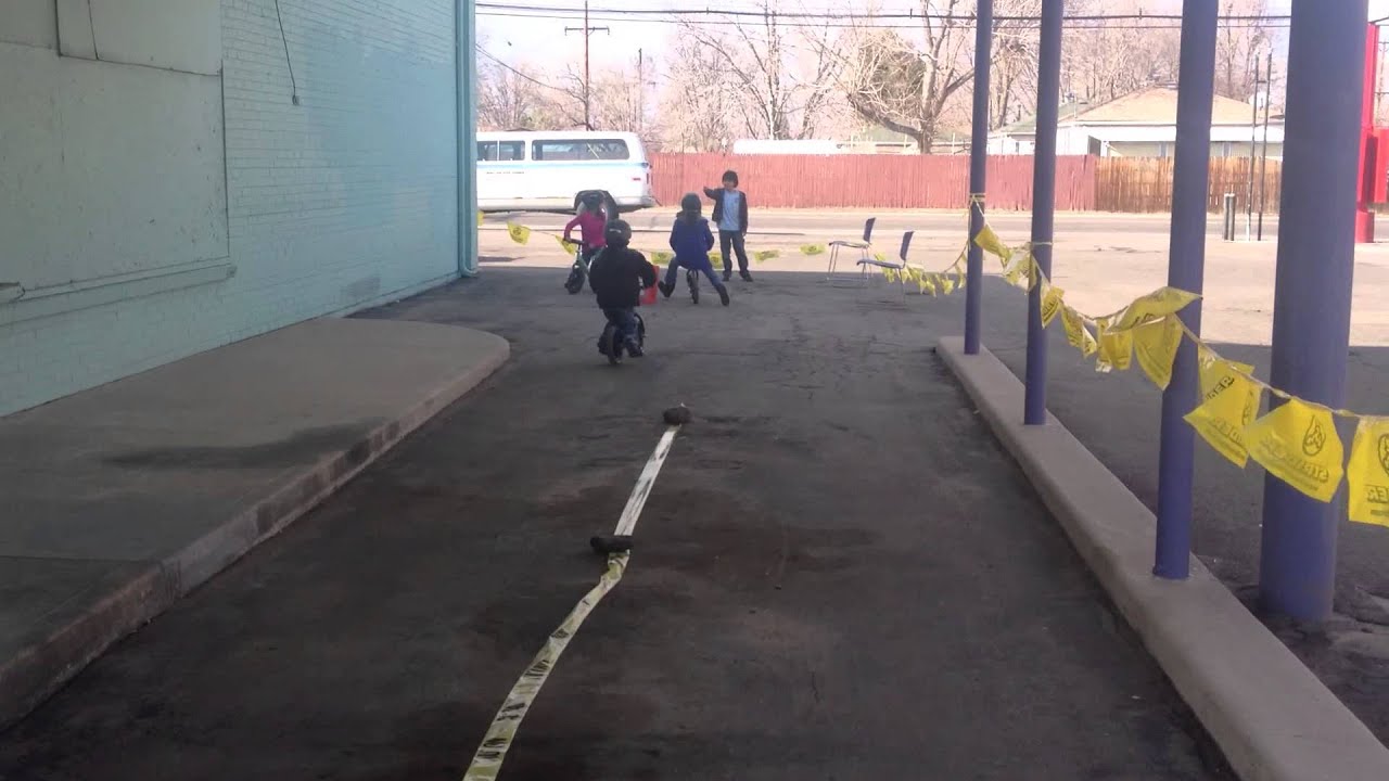 Opening day at Lucky Bikes Re-Cyclery - Kids having fun on Strider bikes