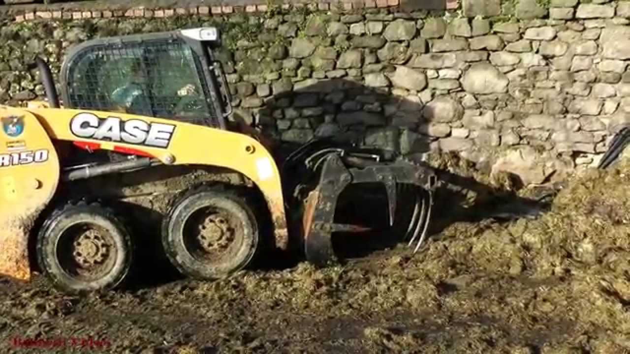 Feeding with Skid-steer. - Loading Silage and Scraping Slurry.