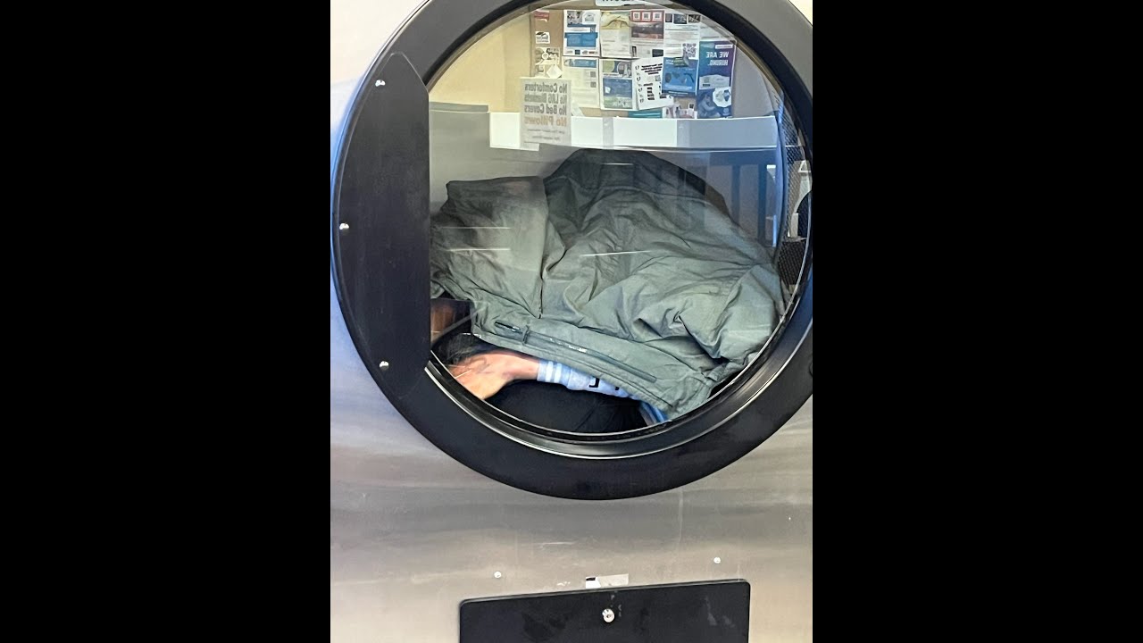 Dude Sleeping in Laundromat Dryer