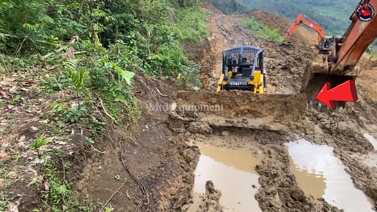 Hitachi excavators lift the stuck Bulldozer