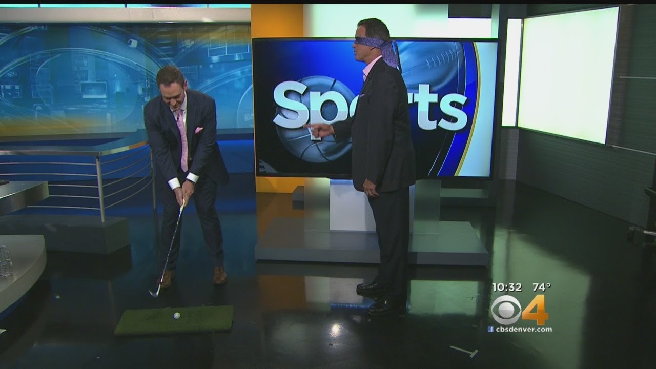 CBS4's Michael Spencer Attemps Chip Shot Over Jim Benemann
