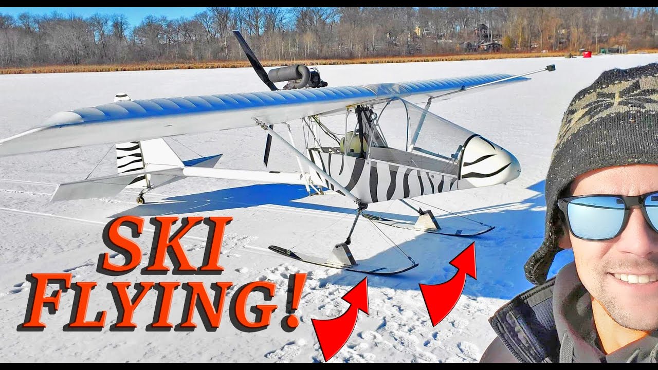 Ultralight Airplane with Snow Skis Lands On Frozen Lakes