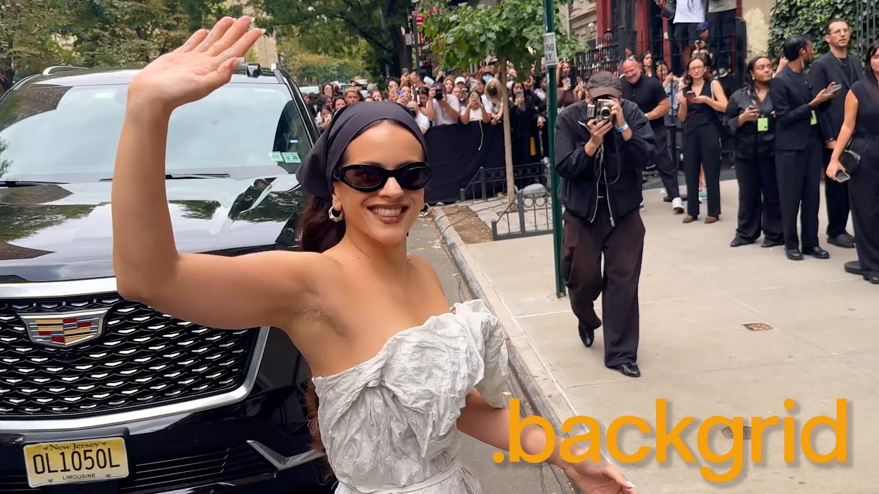 Rosalia is greeted by a huge circle of fans and photographers at the Calvin Klein Fashion Show