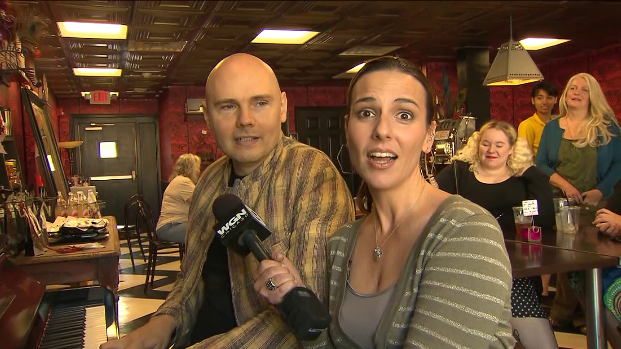 Billy Corgan serenades WGN reporter Ana Belaval on live TV (2013)