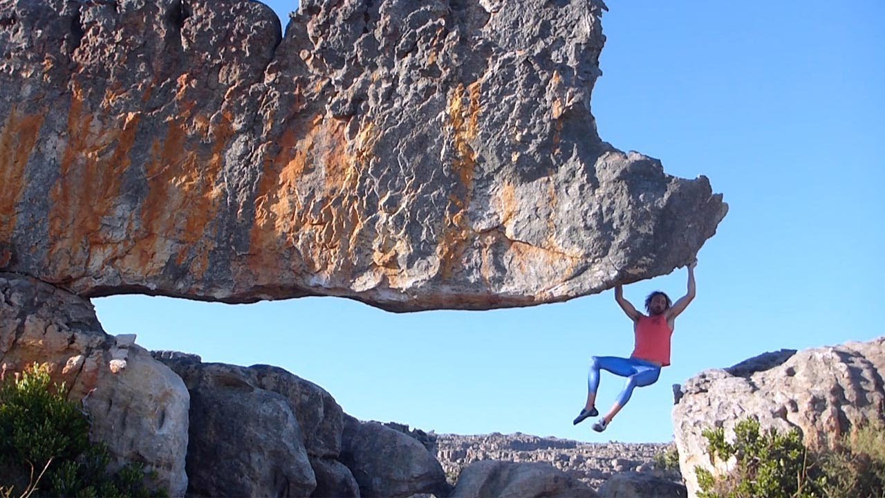 Free Climber Scales Steep Rocks