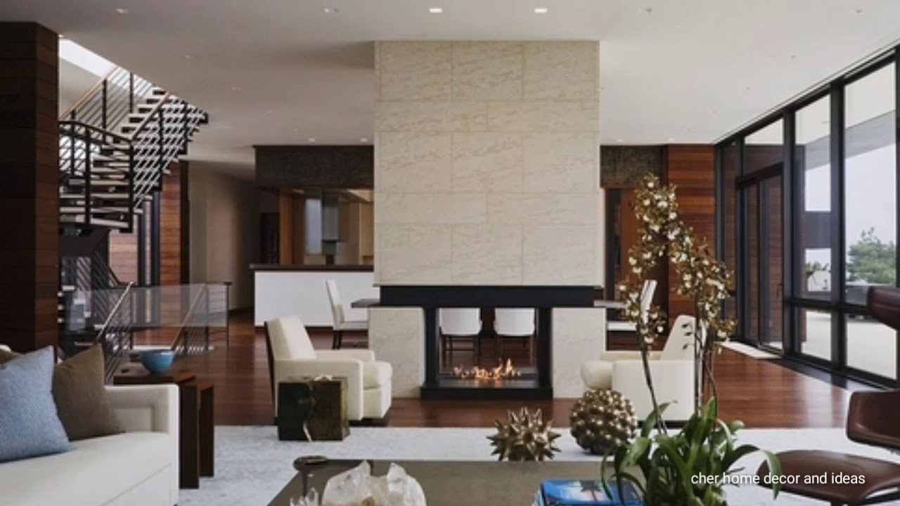 Innovative And Efficient Living Room Layout With A Separation Wall Fireplace