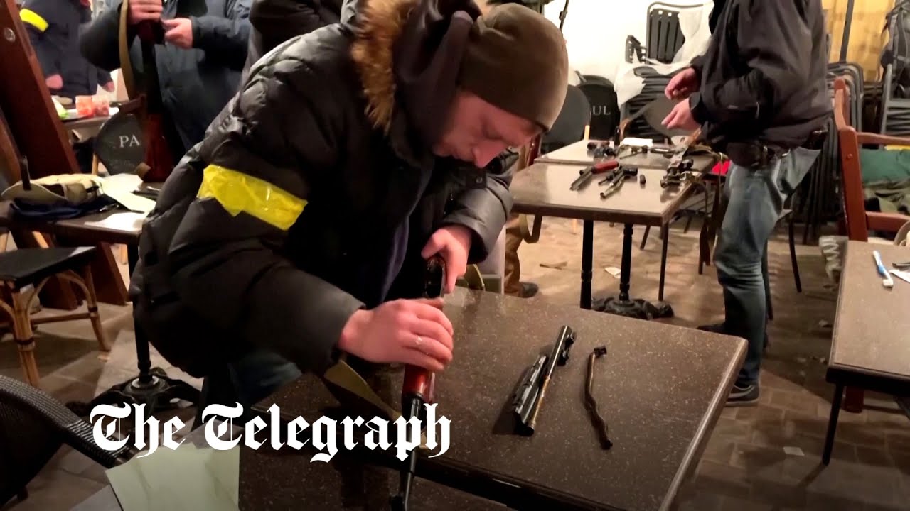 Kyiv residents take up arms as Russian military convoy approaches Ukraine capital