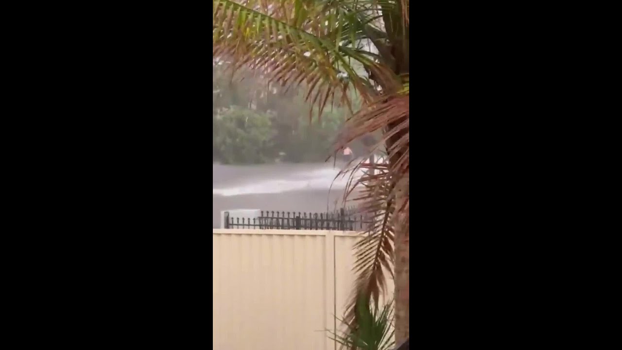 Aussie rides jetski throught Sydney floods