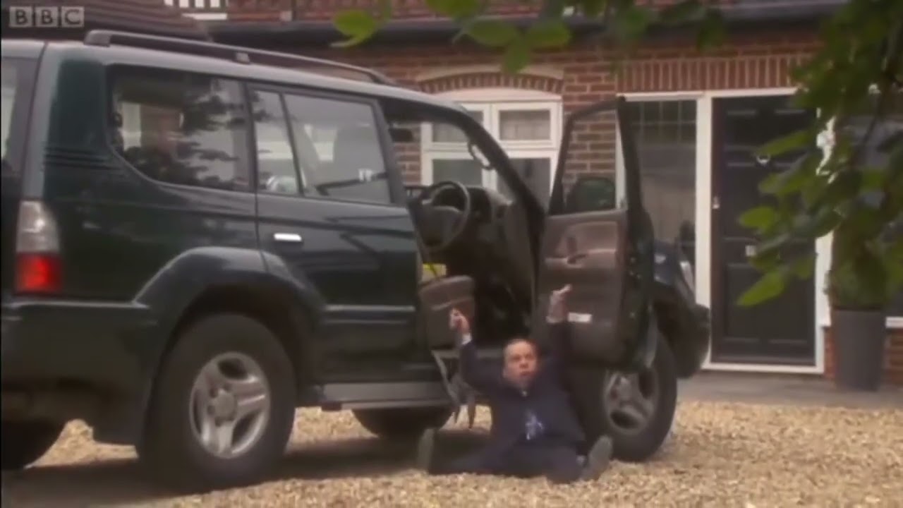 Warwick Davis falls out of car