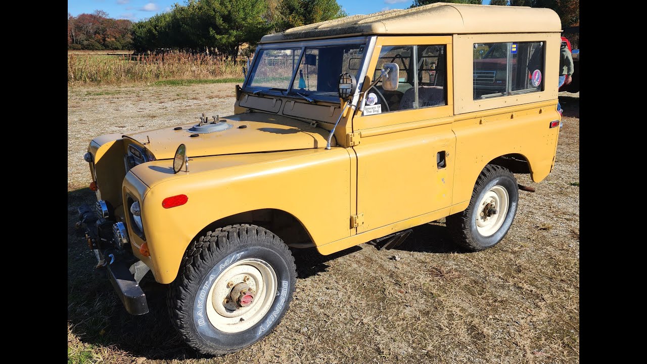 1973 Land Rover Series III 88 Hardtop. Gold in color w/tan top. Selling at Public Auction 11/12/25
