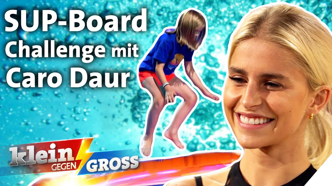 Caro Daur vs. Benno (10): Wer schafft mehr Hocksprünge auf dem SUP-Board? | Klein gegen Groß