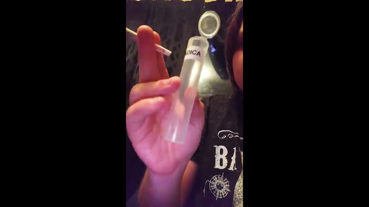 Smoking a raw king size joint