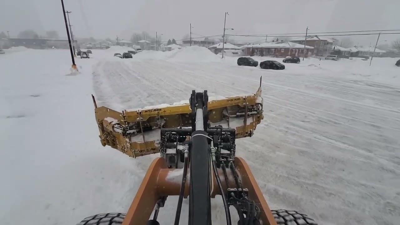 Snow plowing of a big commercial outlet in 14