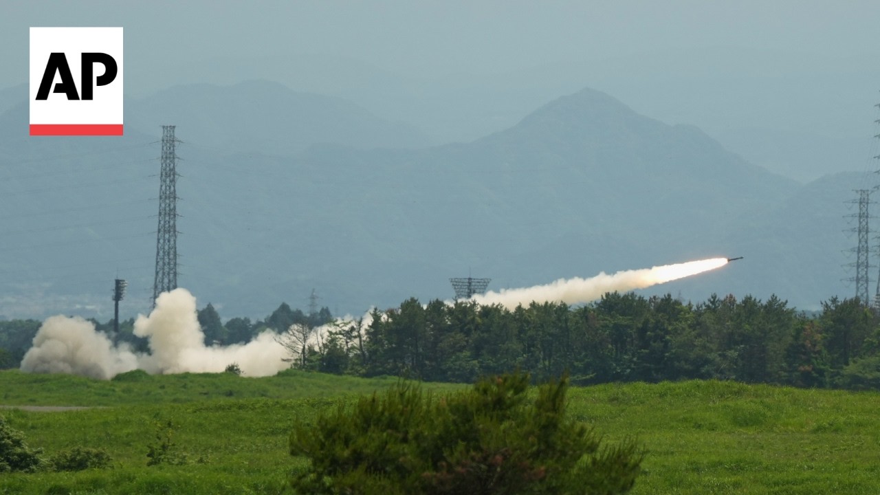 US test fires a dozen rockets from a mobile launcher near Mt. Fuji in Japan