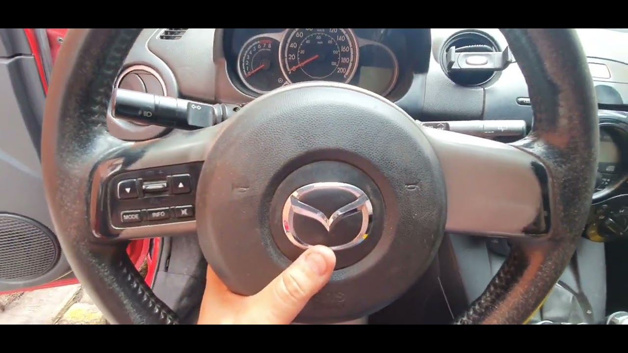 Cómo quitar airbag y marco de volante How to remove steering wheel frame & Airbag Mazda 2 2012 2015