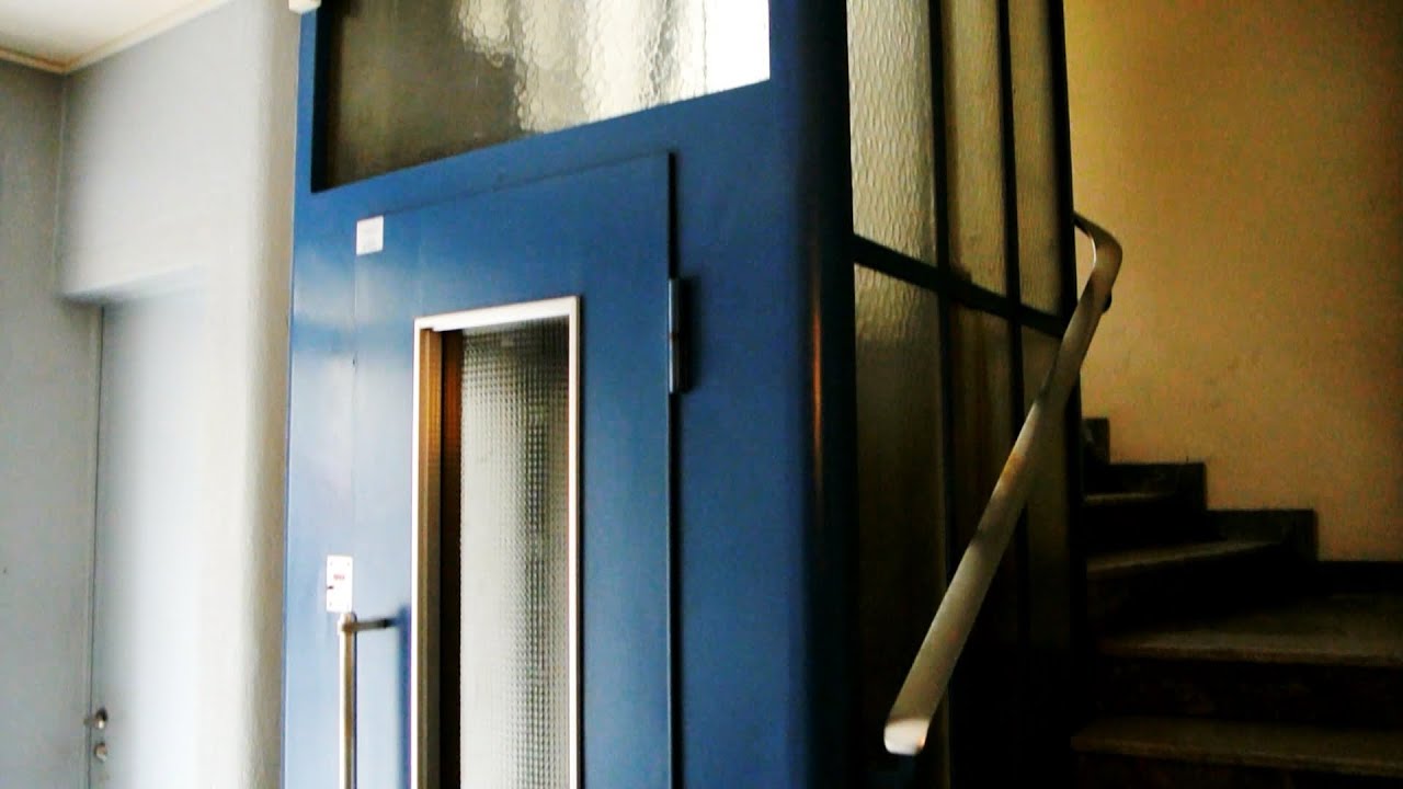 1952 Schindler single-speed traction elevator in glass shaft - in Zürich, Switzerland