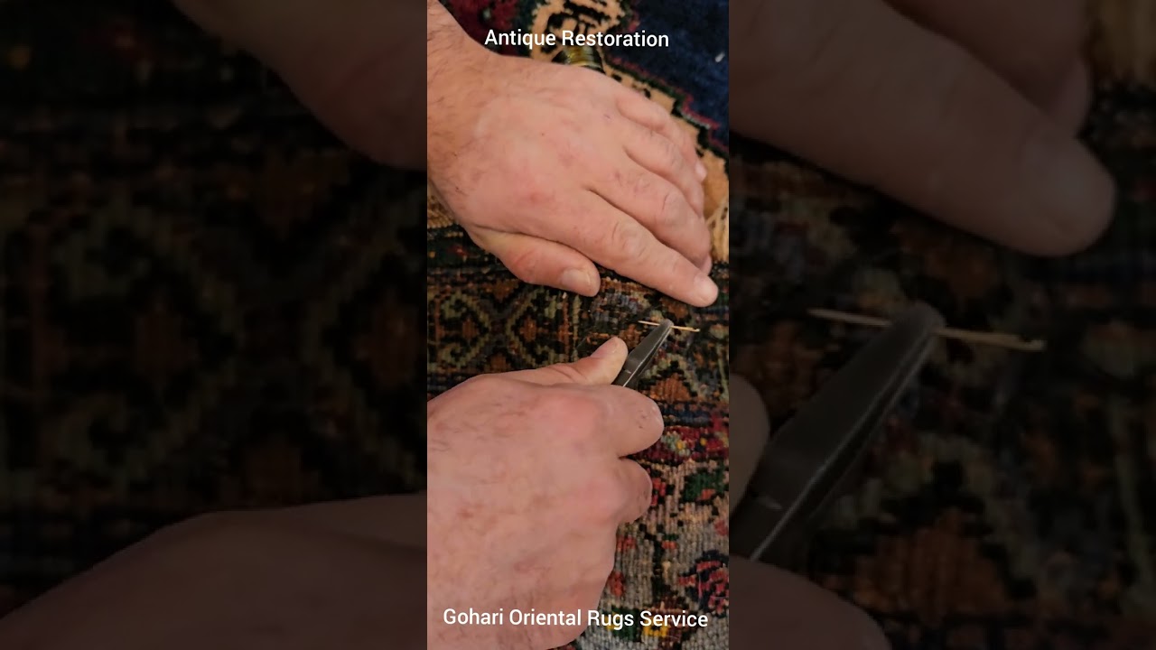 Repairing a tear part on   antique Persian carpet for the German ambassador