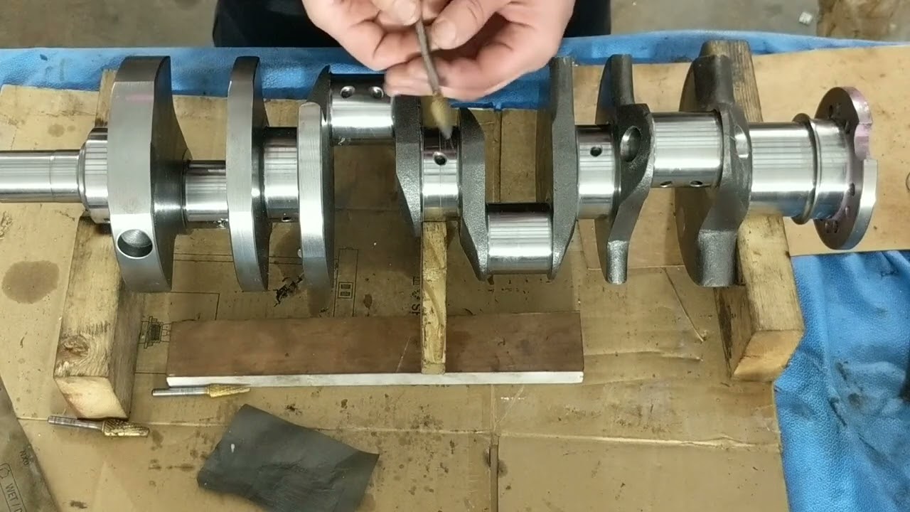 Part one, Stroker crank smoothing and radius the oil holes. Clearances.
