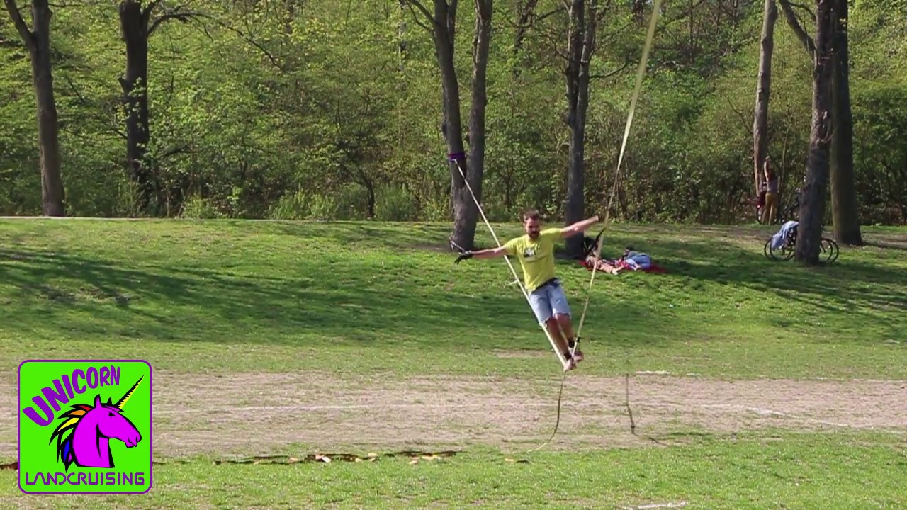 Simon playing on the Landcruising Unicorn slackline
