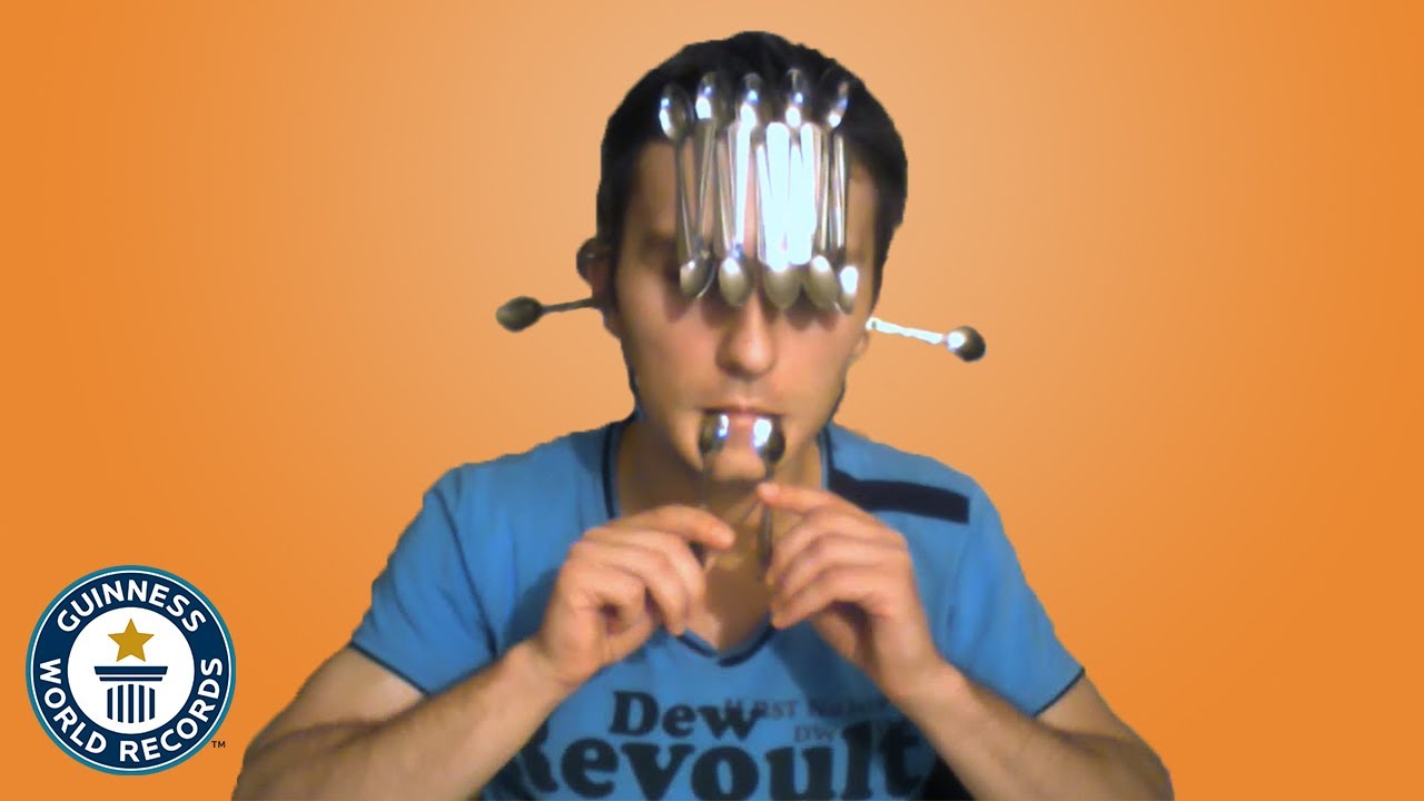 How many spoons can he balance on his face?  - Guinness World Records