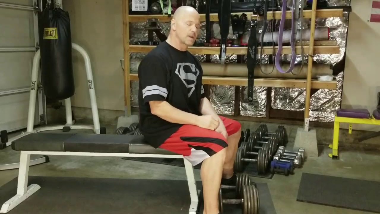 How to pick up heavy dumbbells safely