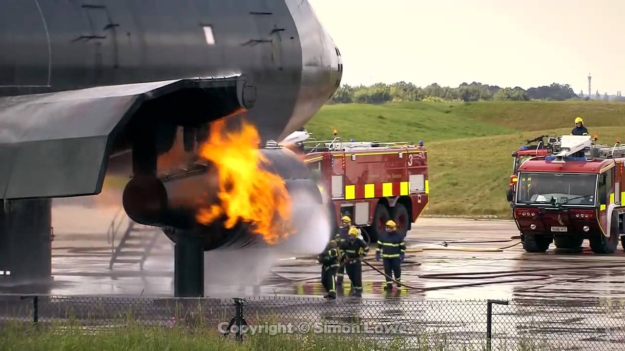 Airport fire fighter training excercise. Manchester Airport UK