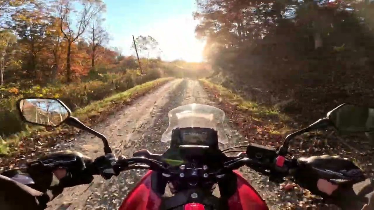 Trying small windshield on NC700X. Pavement & Gravel. 