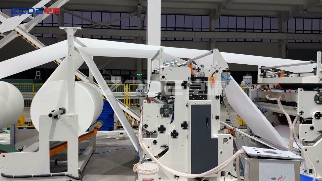 Automatic interfold hand towel facial tissue line including packing with nylon film