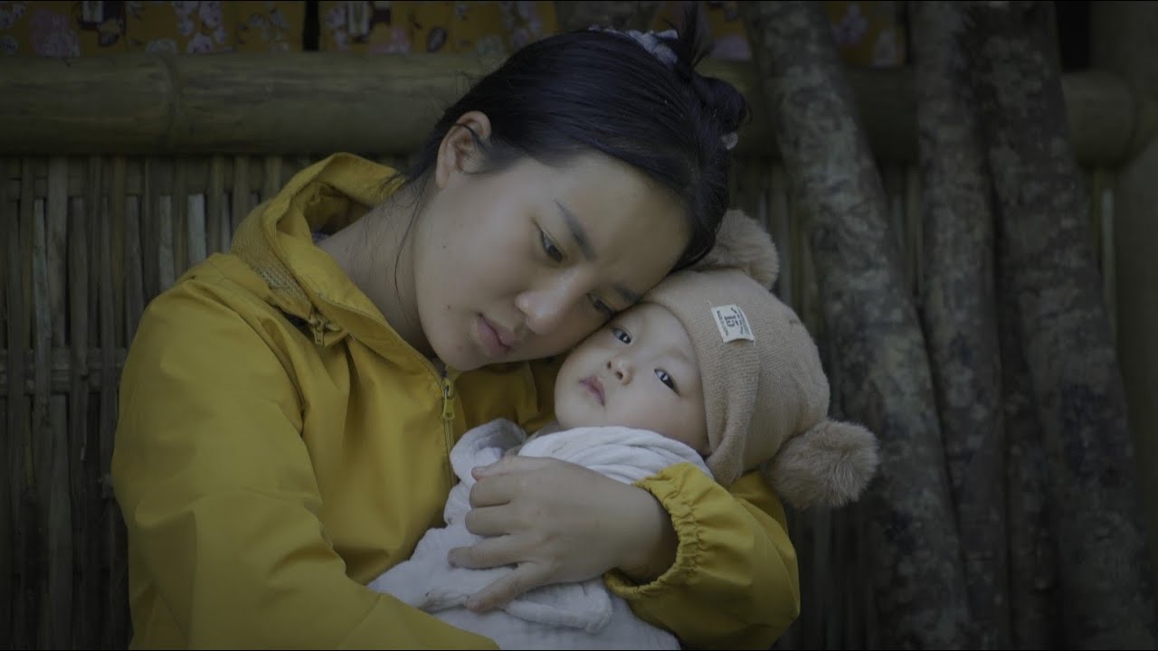 Alone in the middle of the jungle, the mother constantly fights illness to protect her weak child.