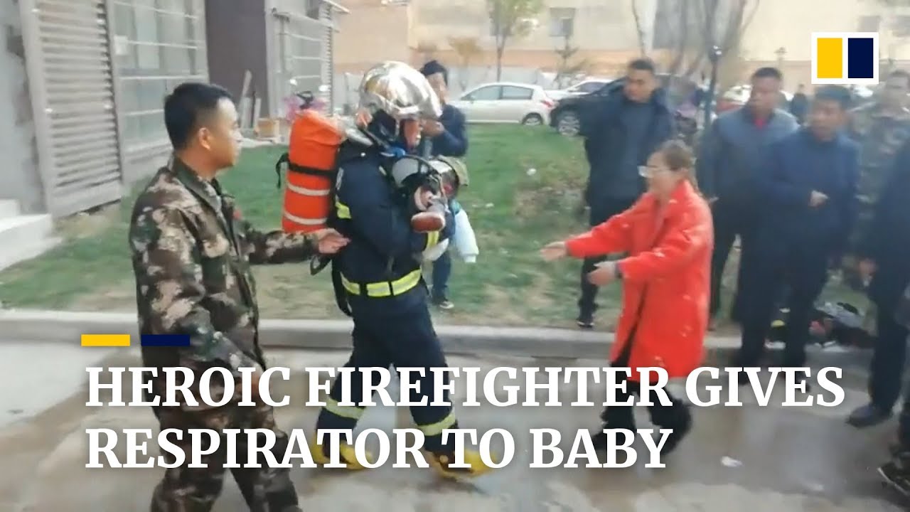 Heroic Chinese firefighter gives his respirator to baby